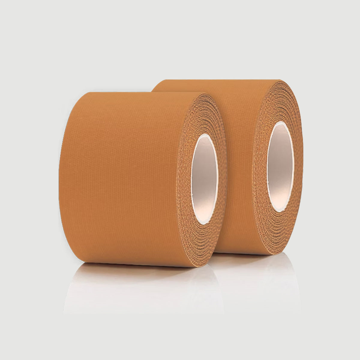 Two rolls of brown tape on a light gray background