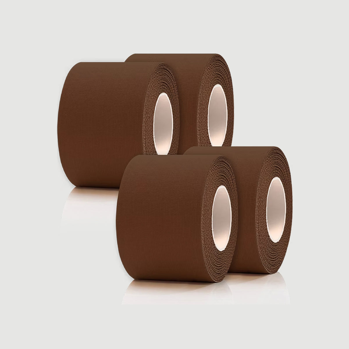 Three rolls of brown tape on a light gray background