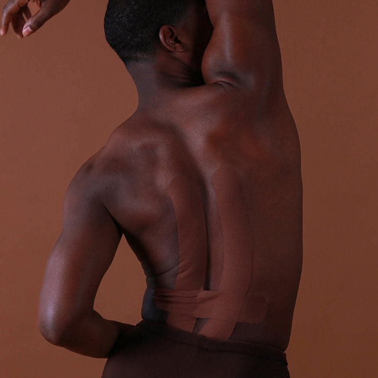 Man with a muscular back against a brown background