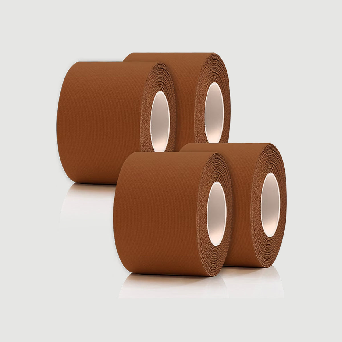 Three rolls of brown tape on a light gray background