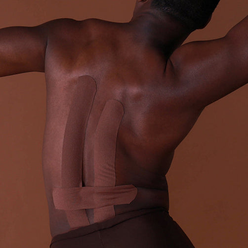 Partial view of a person with a brown background
