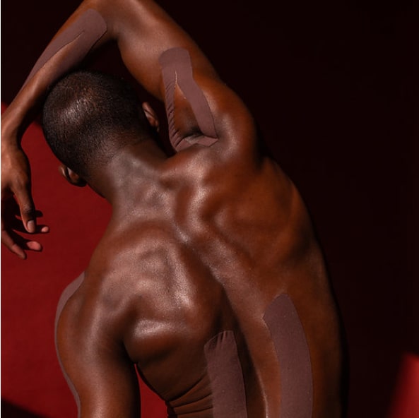 View of man's back with red background